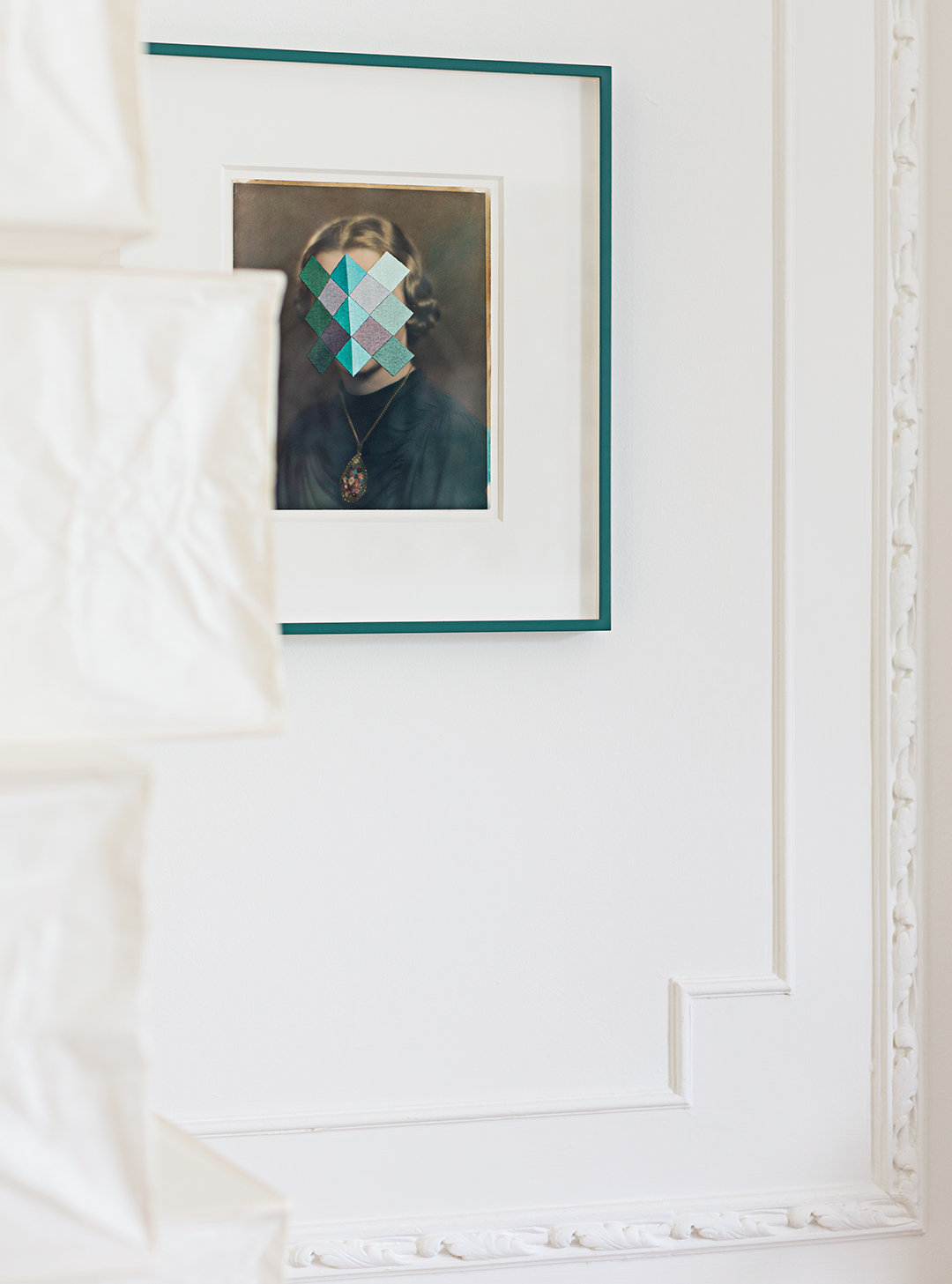 modern artwork on white wall with molding