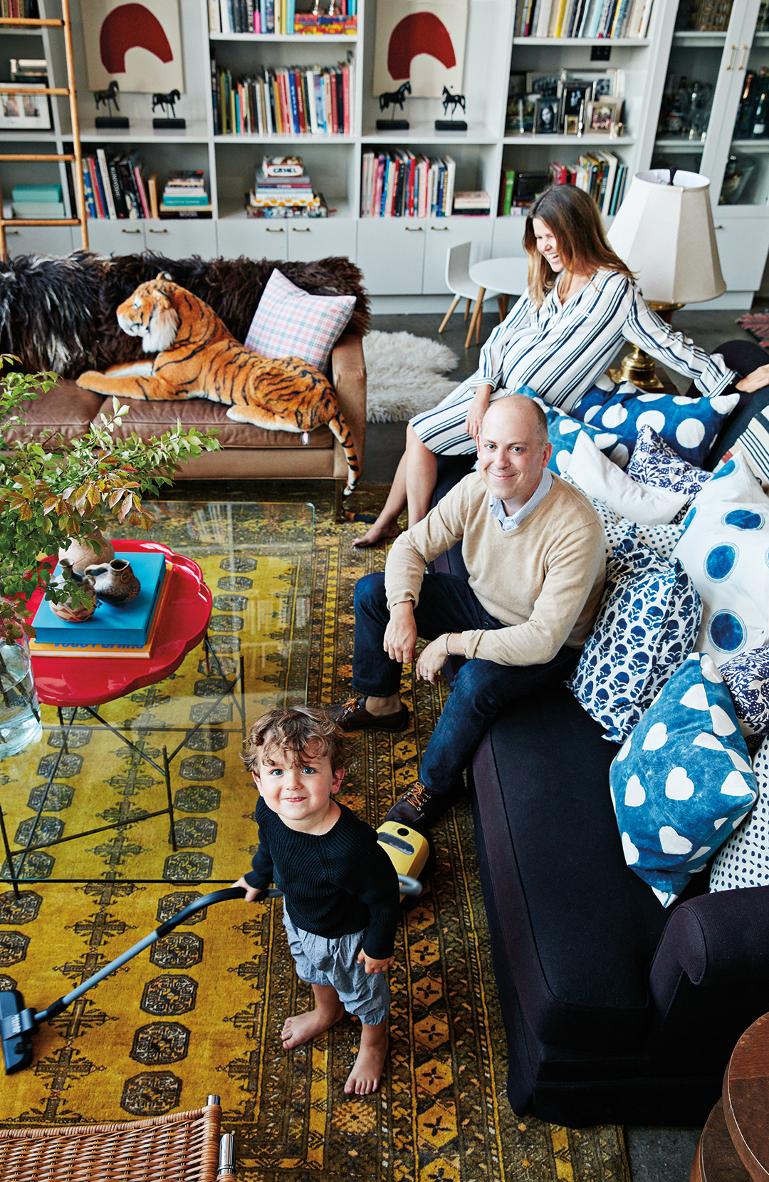 family in living room with patterned rug