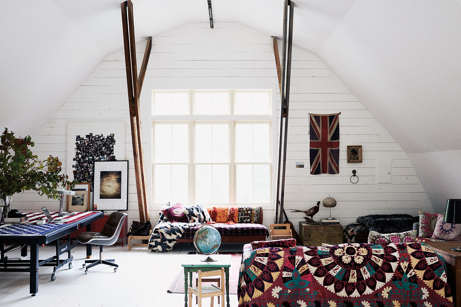 sofas layered with colorful textiles in farmhouse