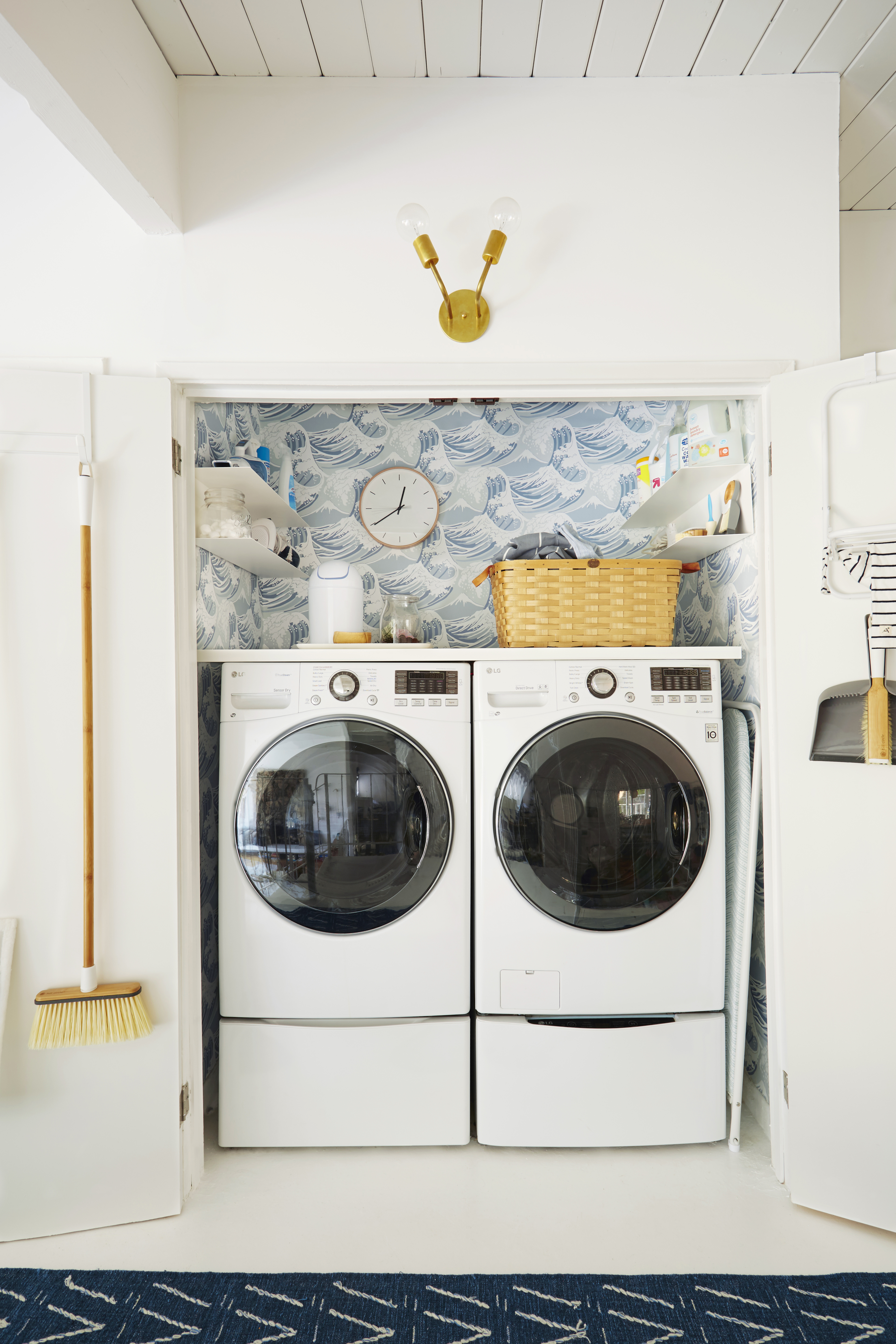 laundry closet with blue ocean wallpaper