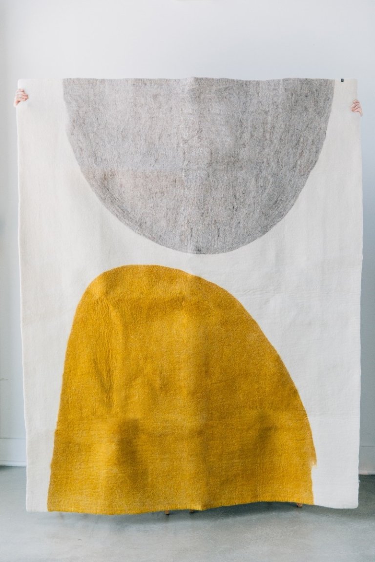  rug with a ochre and grey shape on either end