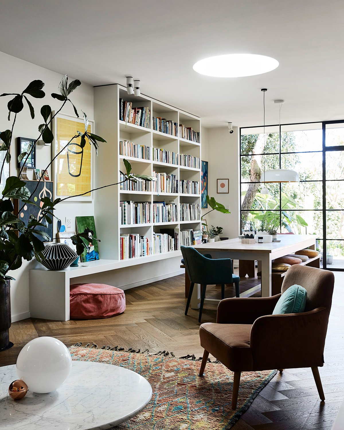 sitting area with wall-to-wall bookshelves