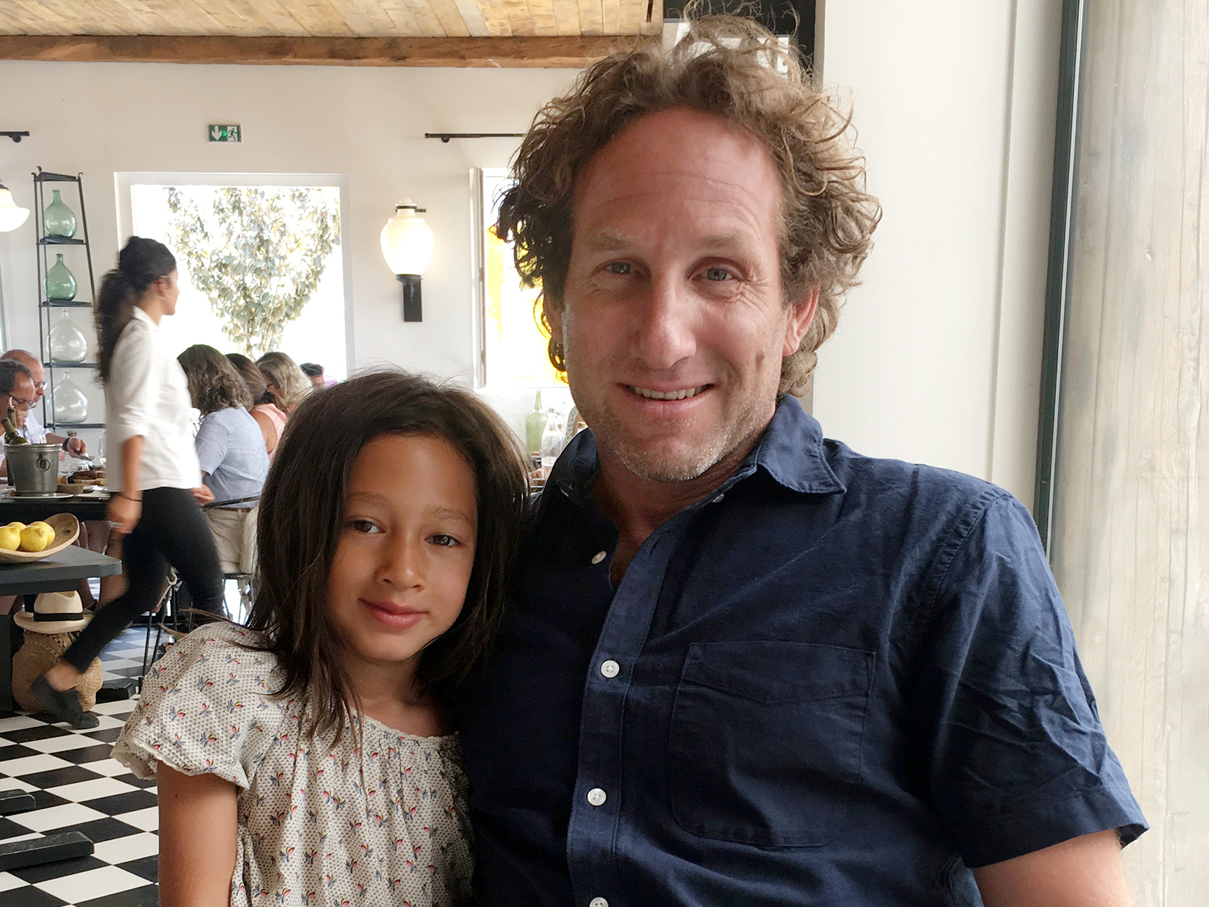 man with child at a restaurant