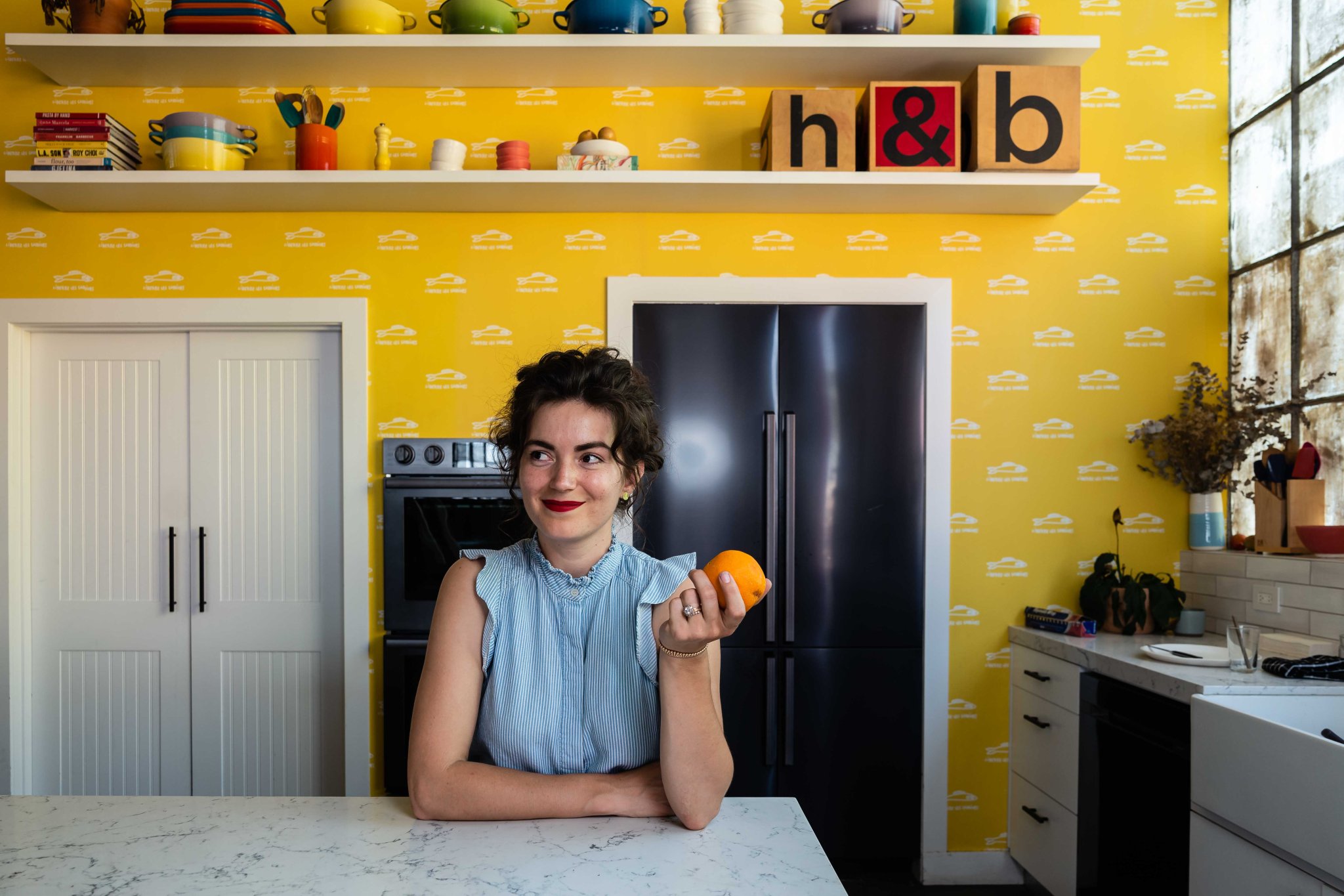woman in a yellow kitchen