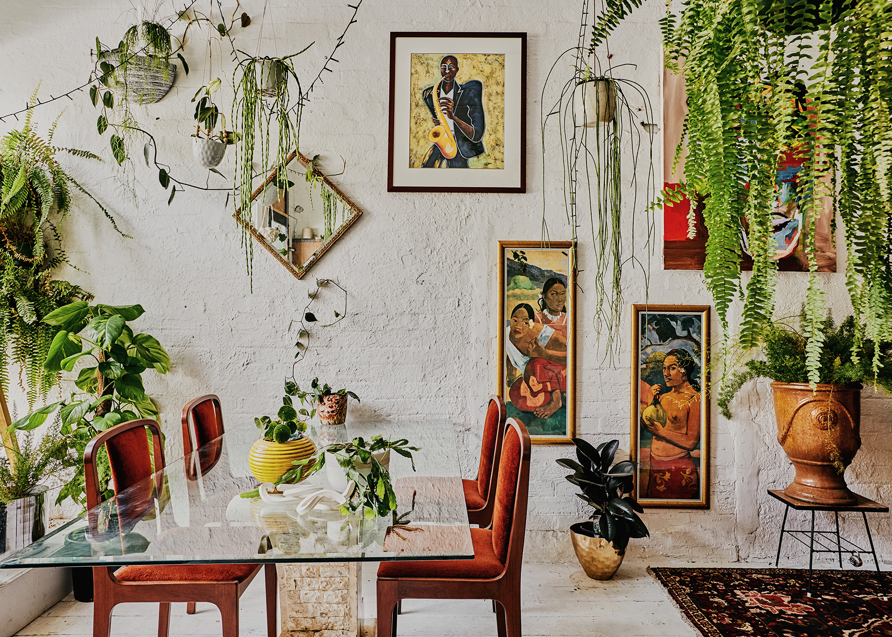 Dining room with plants and art