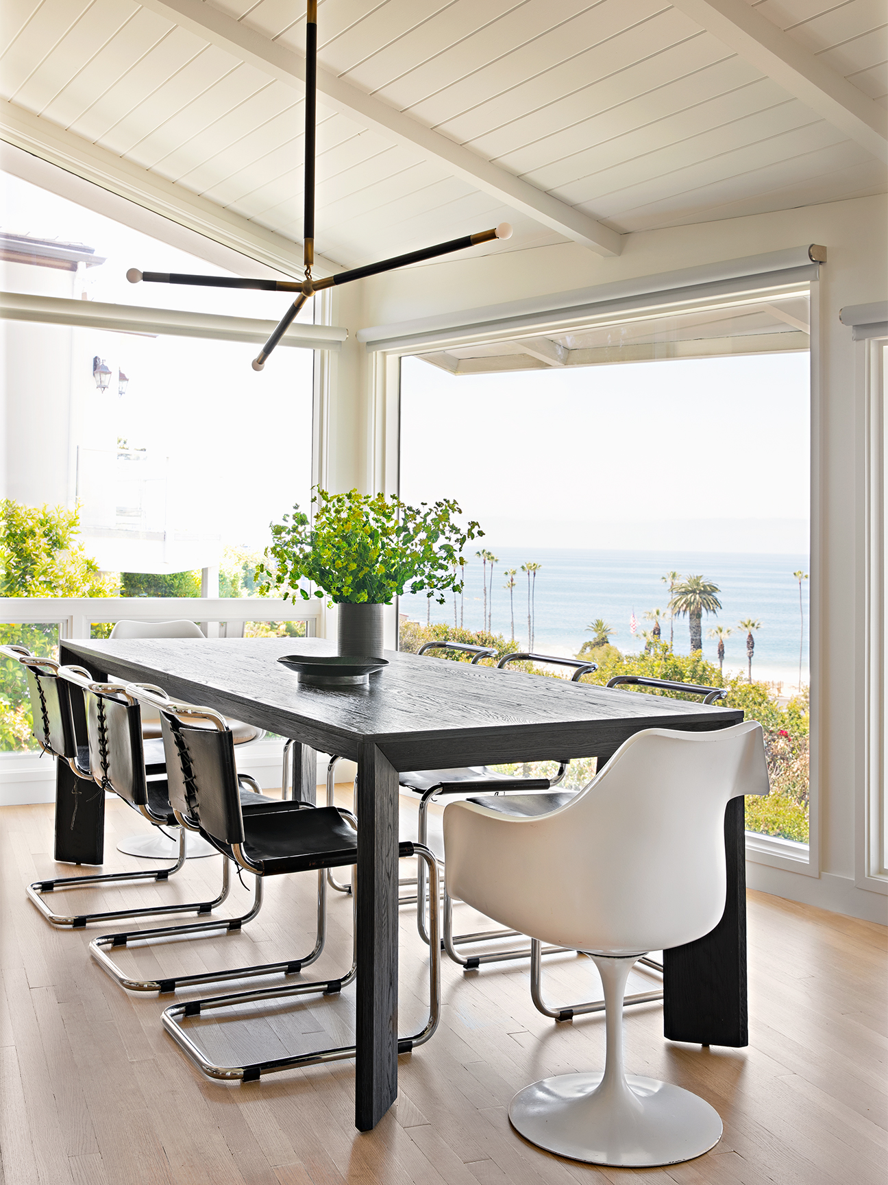 dark dining table with slanted white ceiling