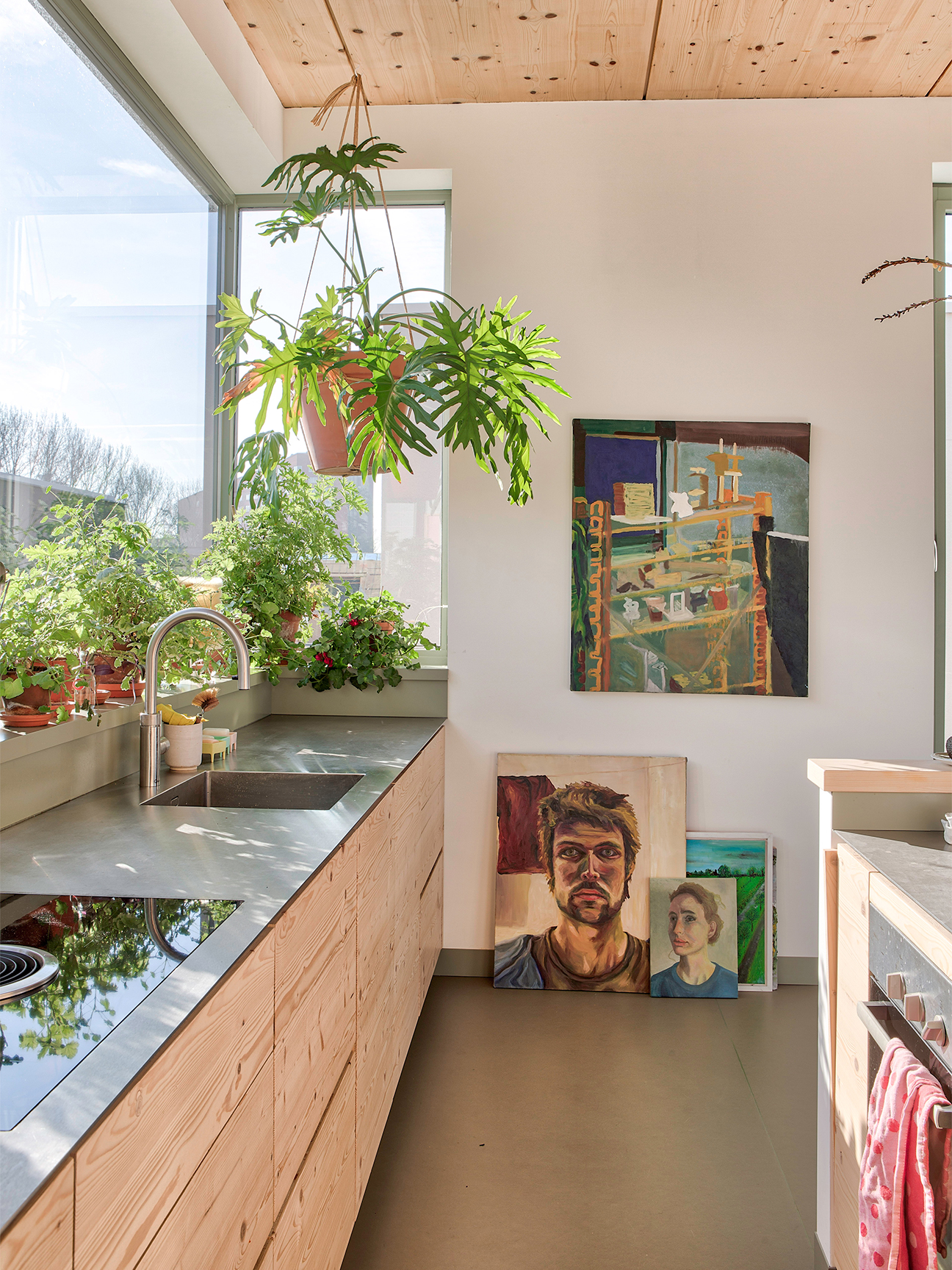 pale wood ceiling kitchen with stainlesss steel counters