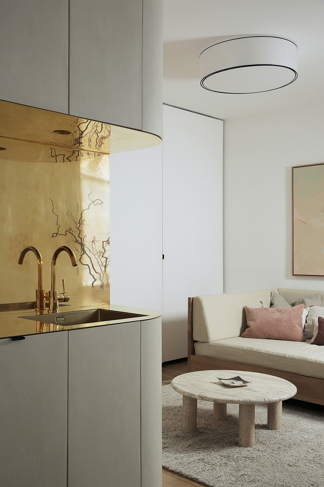 modern apartment with brass backsplash