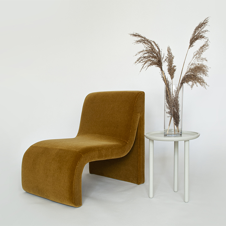 ochre curved armchair
