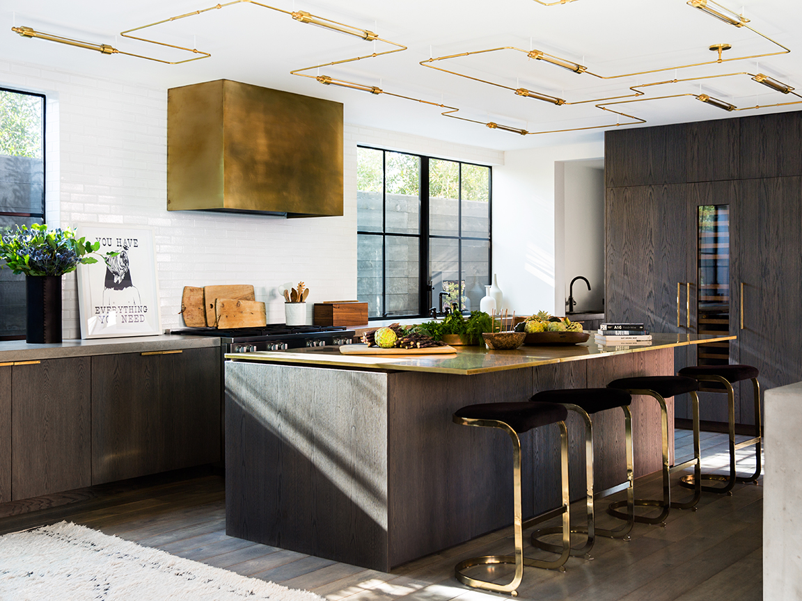 dark kitchen with brass hood