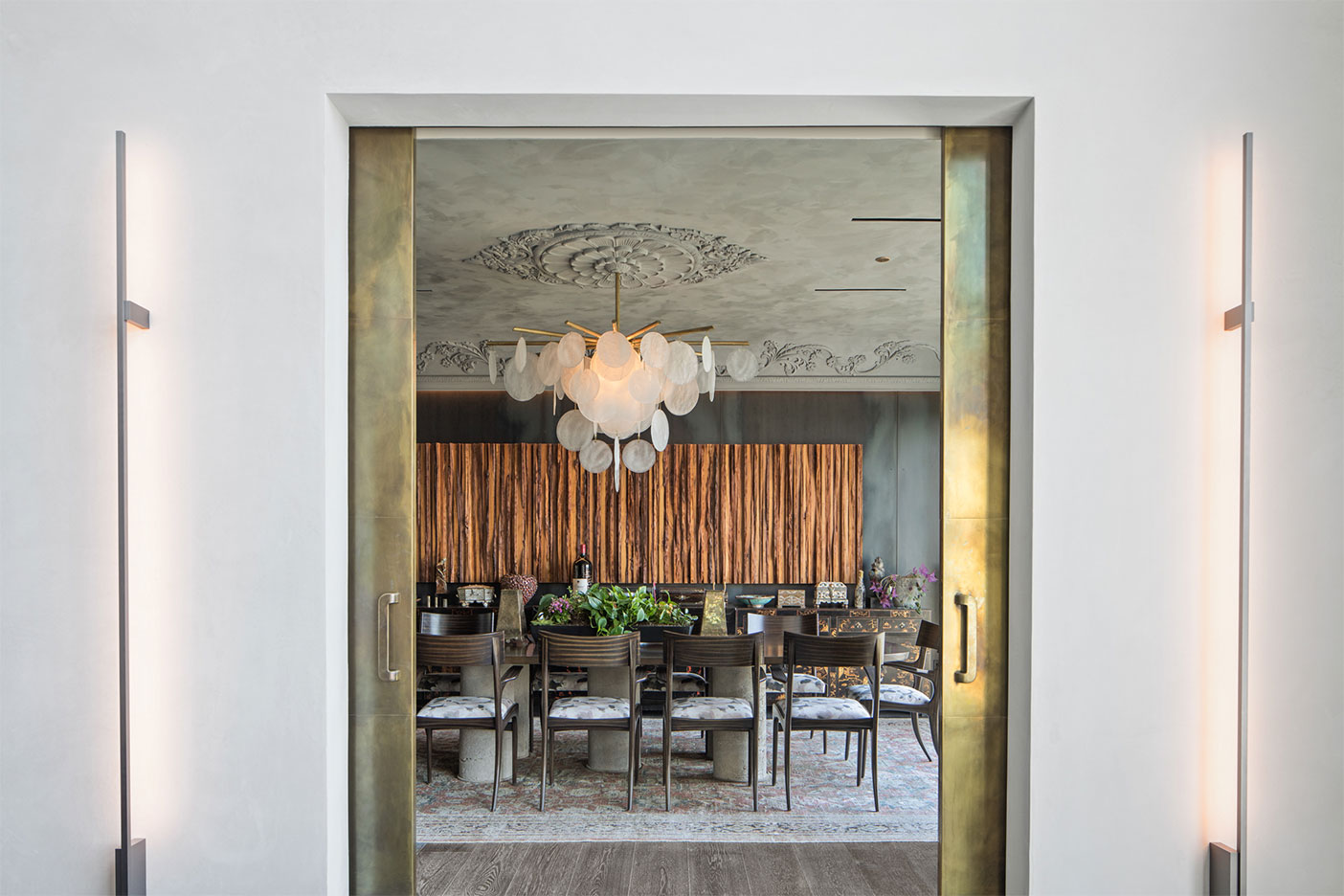 brass doors leading to dining room
