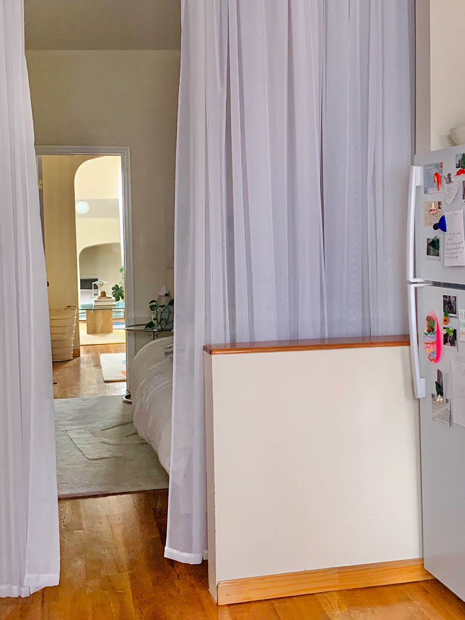 a fabric divider in a room