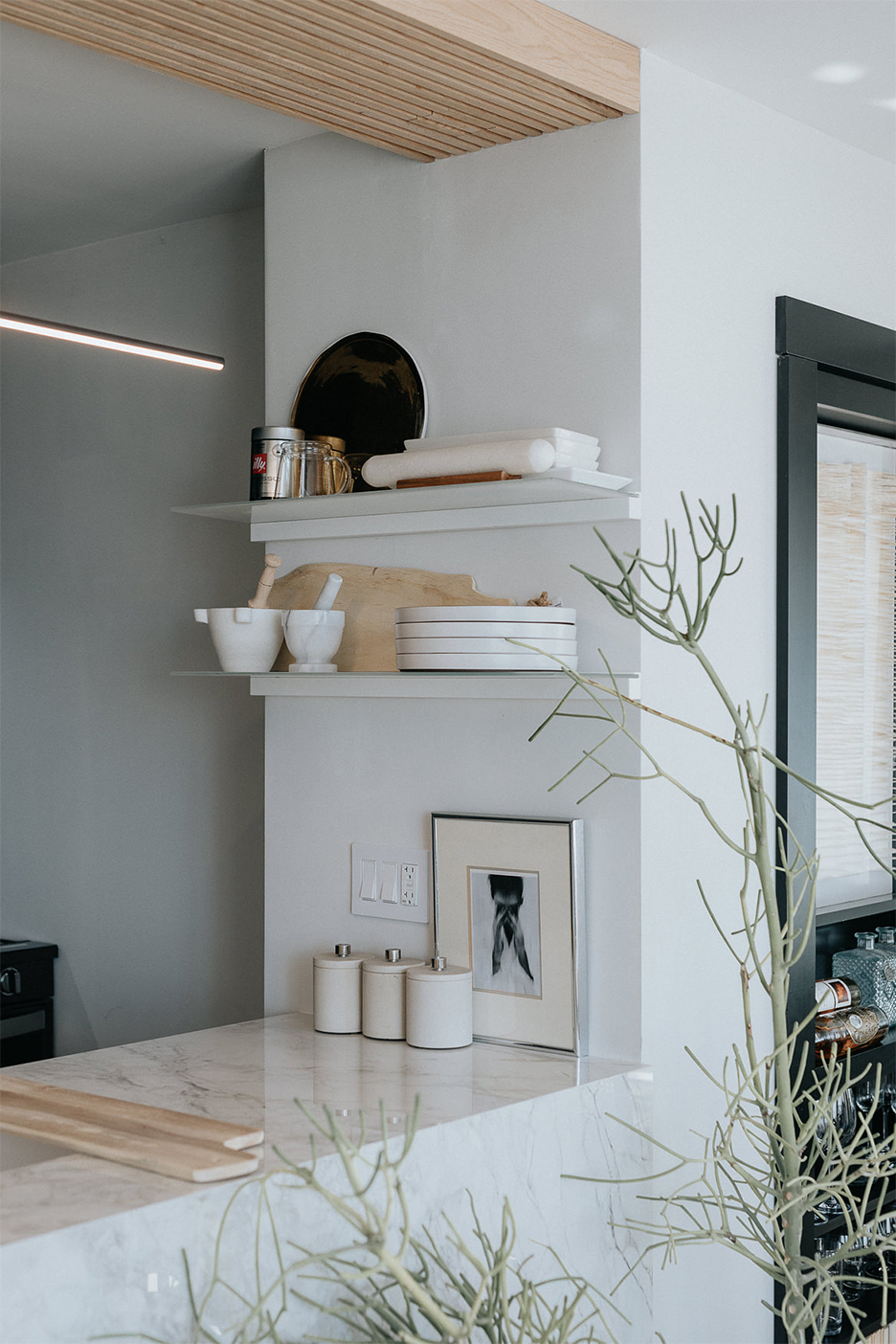 floating shelves over peninsula