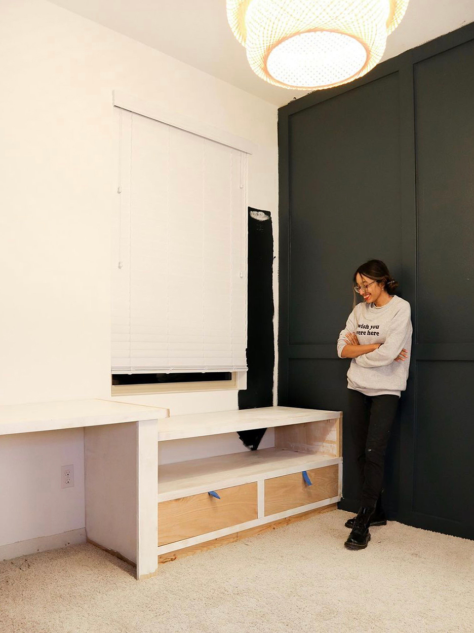 woman looking at half built drawers