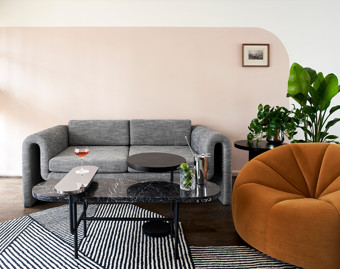 living room with curved pink paint treatment