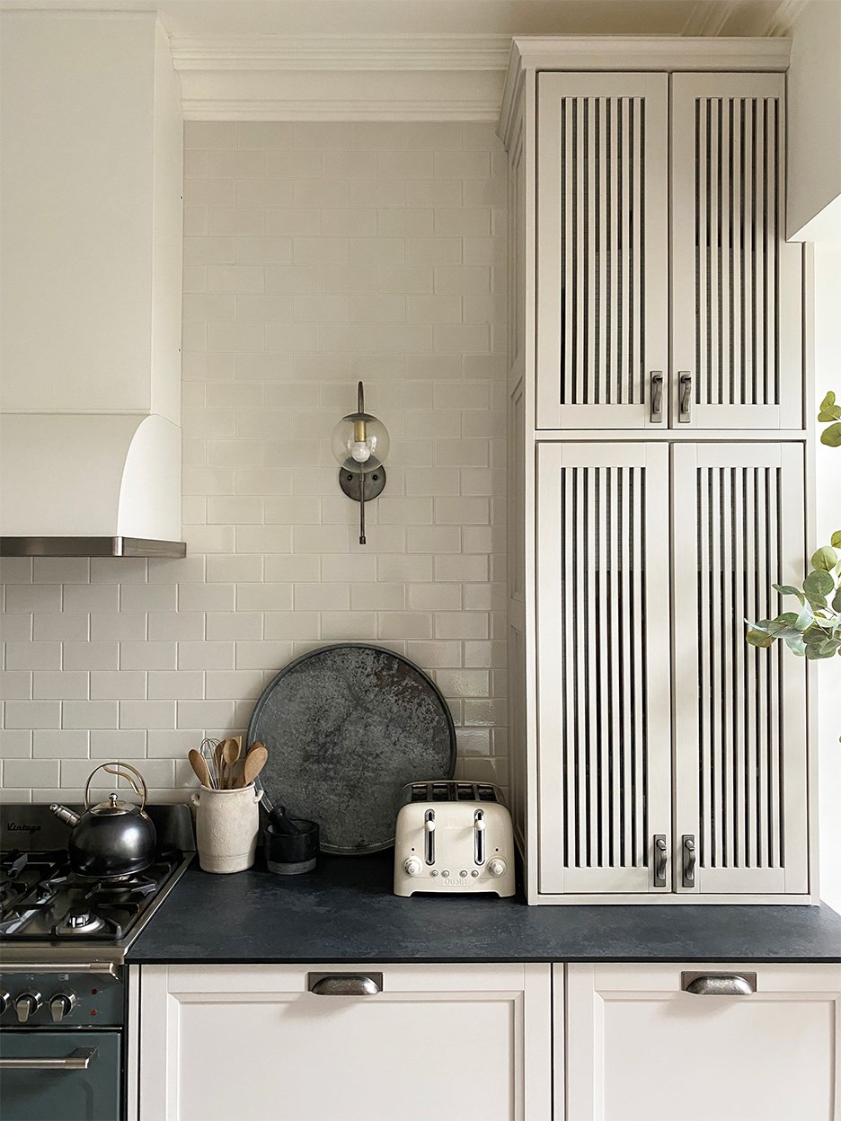white kitchen with dark countertops