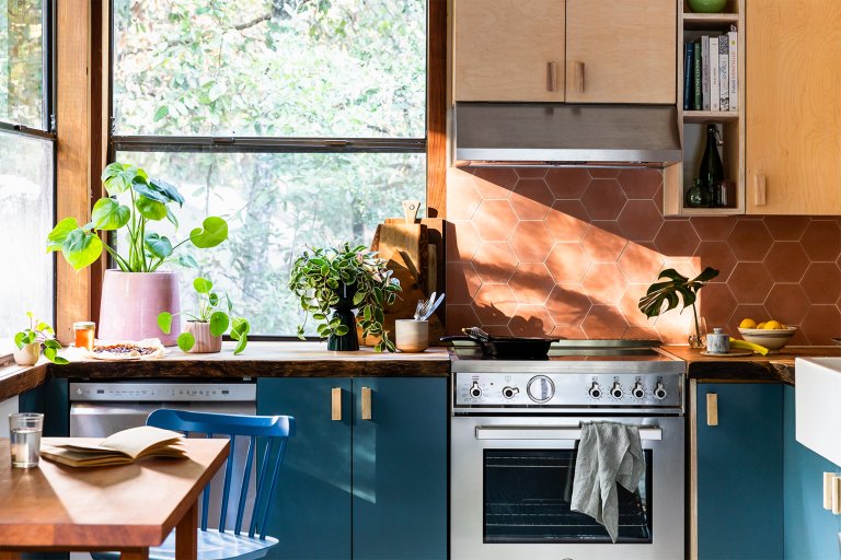 terracotta backsplash and blue kitchen cabinets