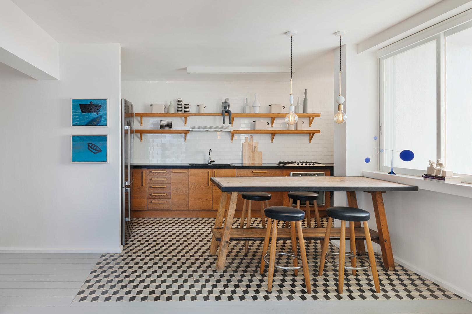 wooden kitchen appliances and table, white walls