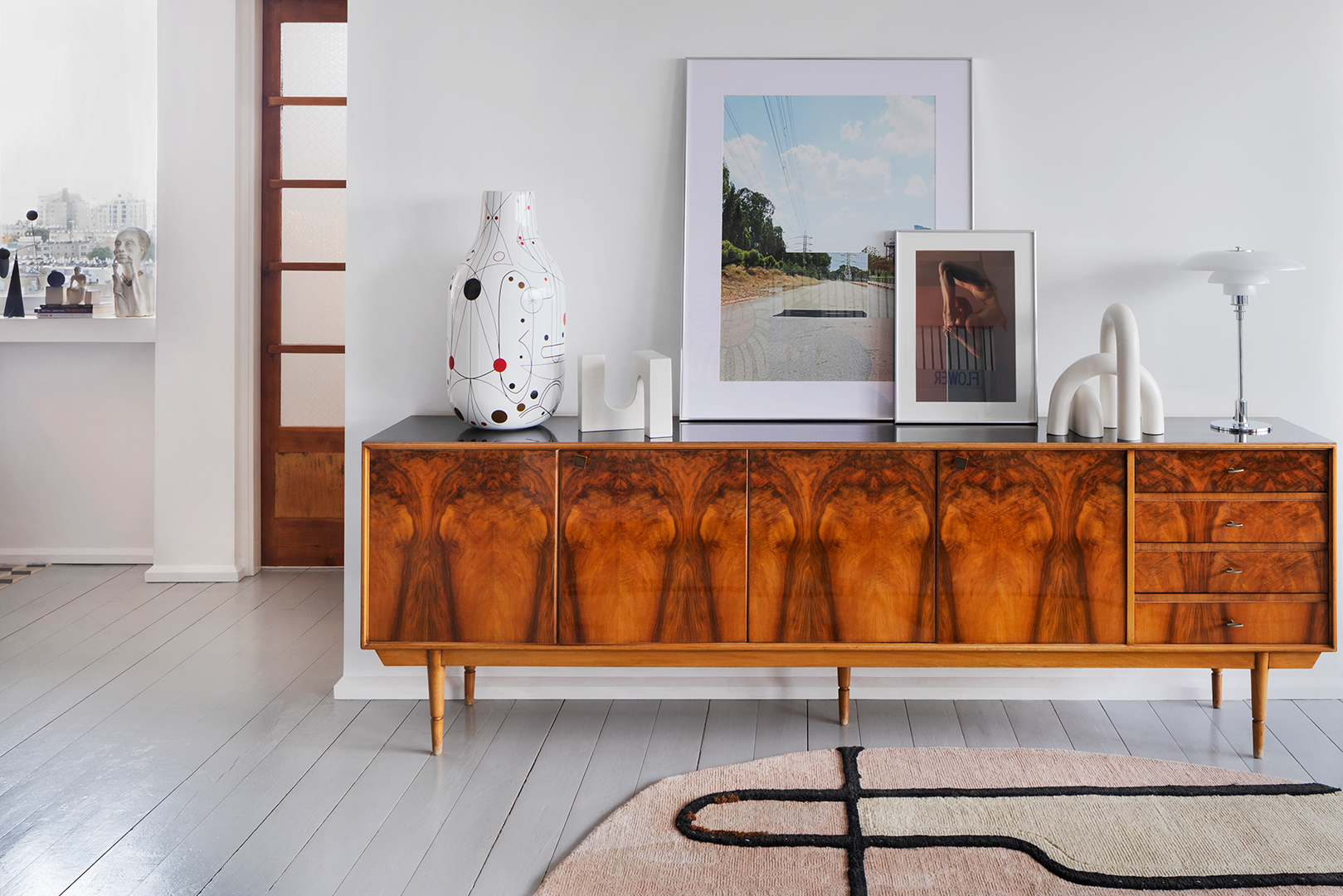 wooden sideboard and white walls