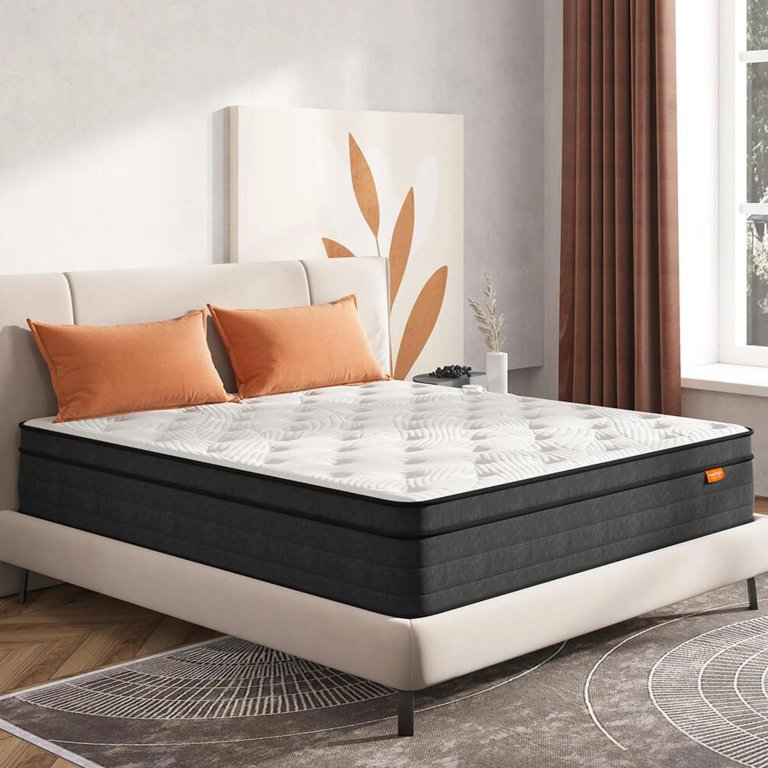  Hybrid mattress with orange pillows