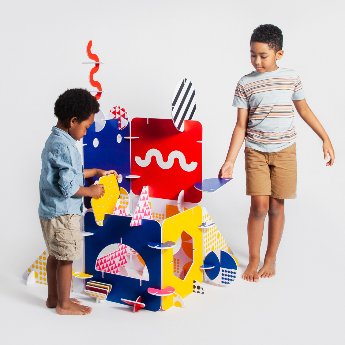 two kids buildign fort