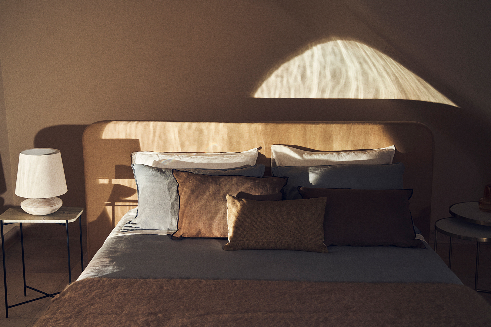 bed with moody lighting