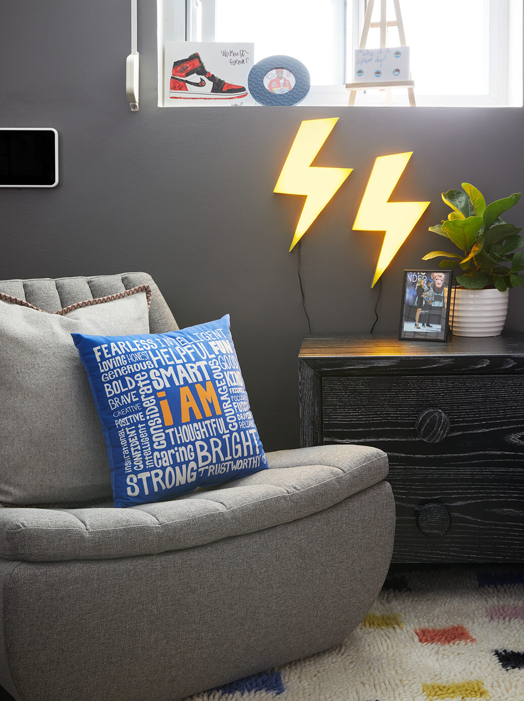 gray chair with blue pillow