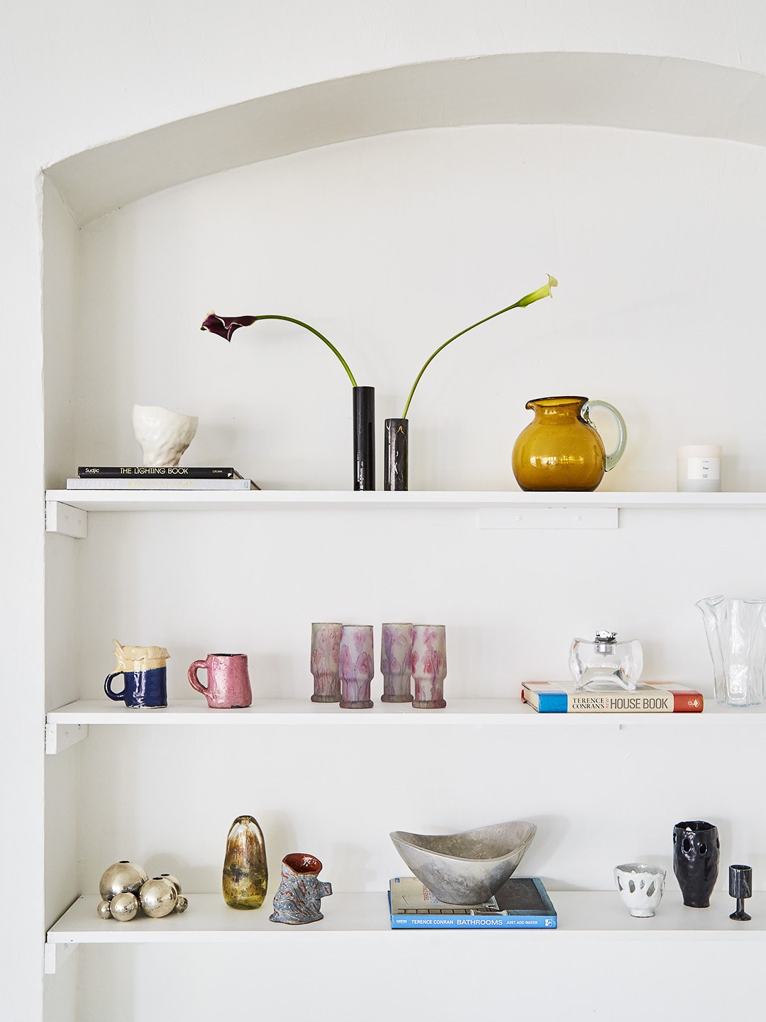 vessels on white shelf