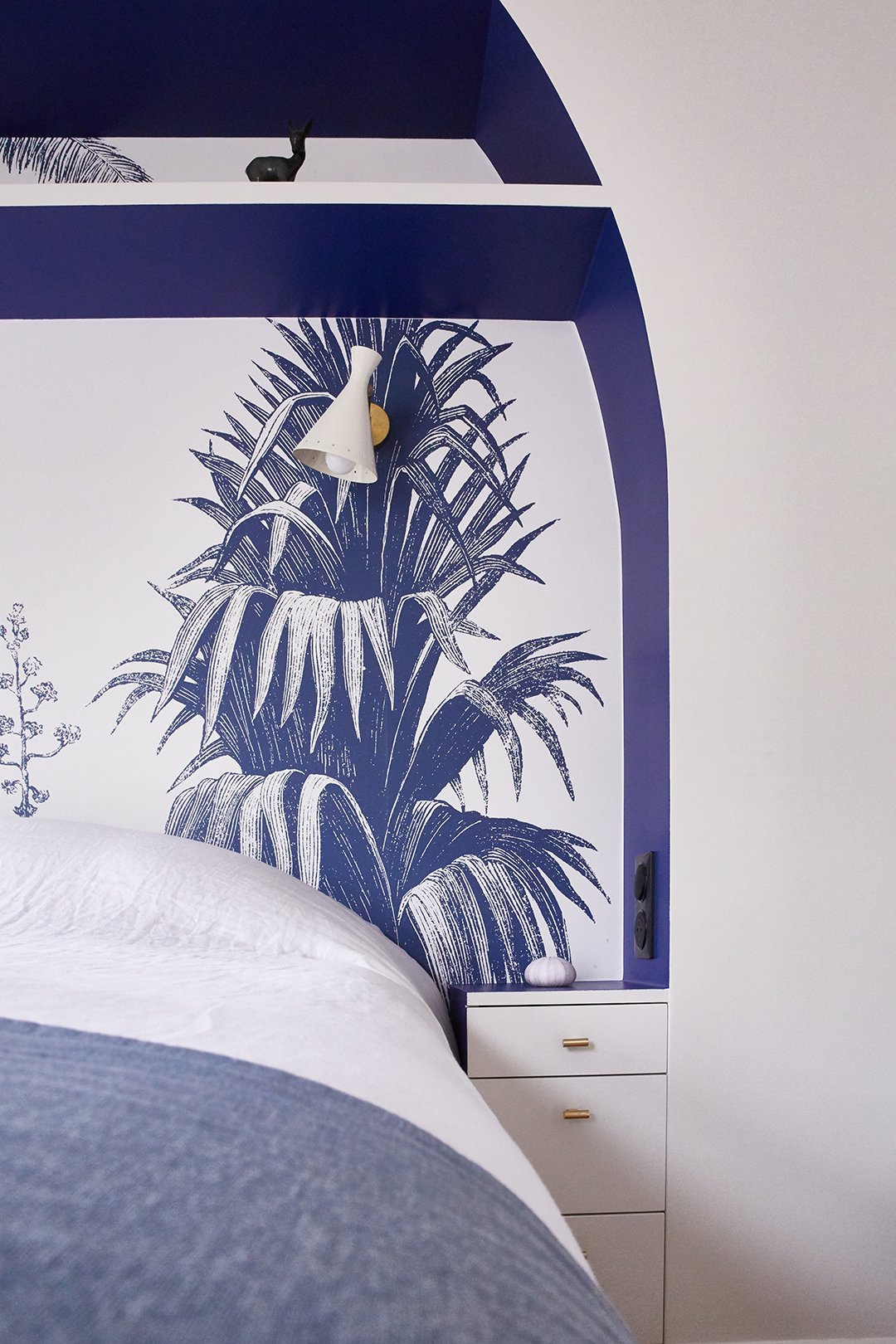 arched blue leaf-print headboard