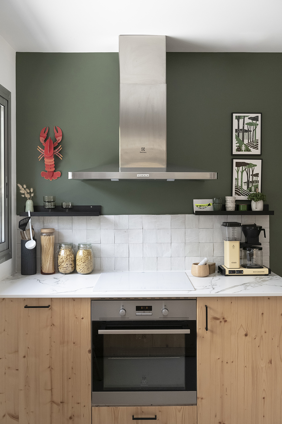kitchen range with wall painted green