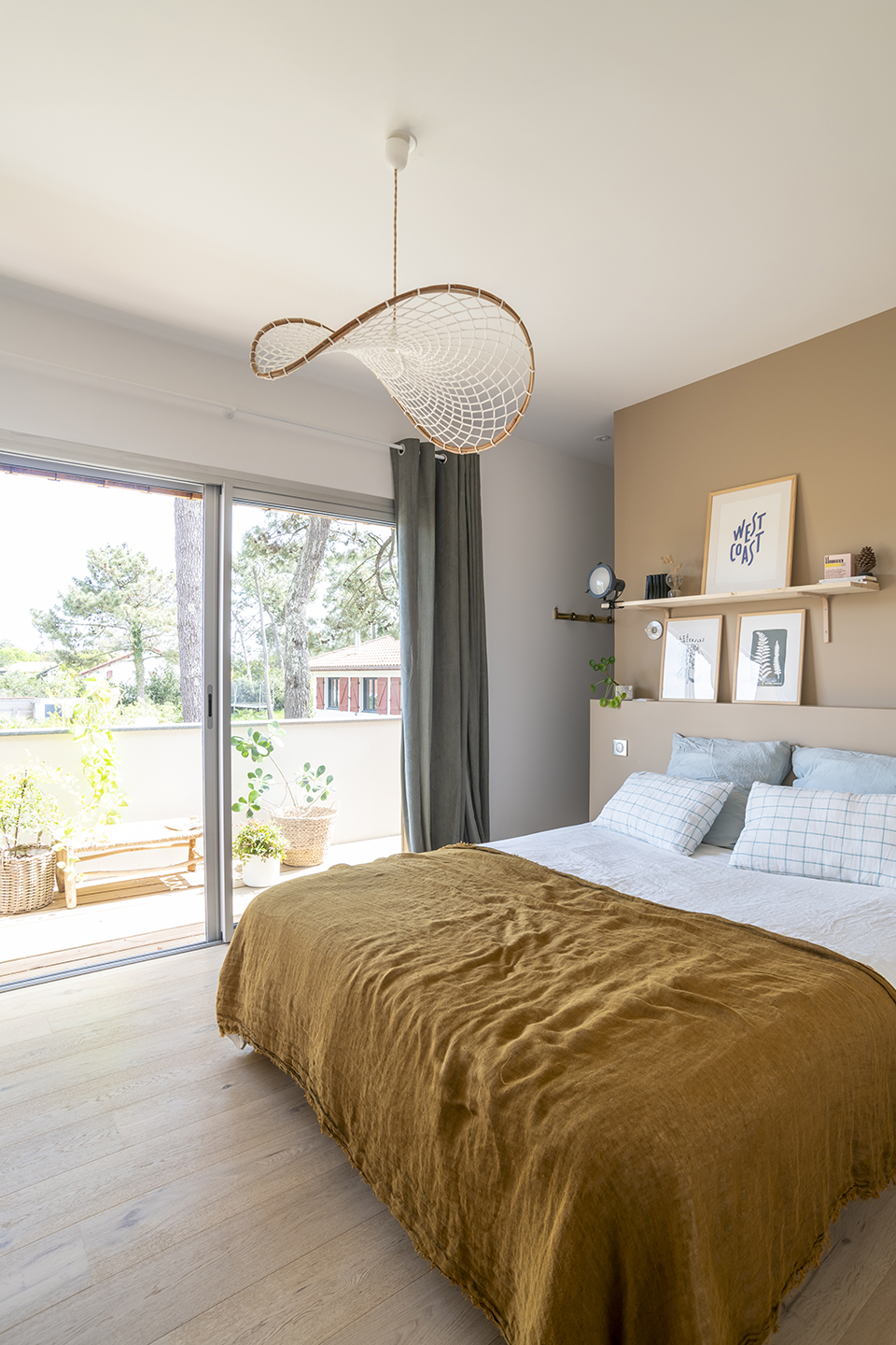 white bedroom with shelf as headboard