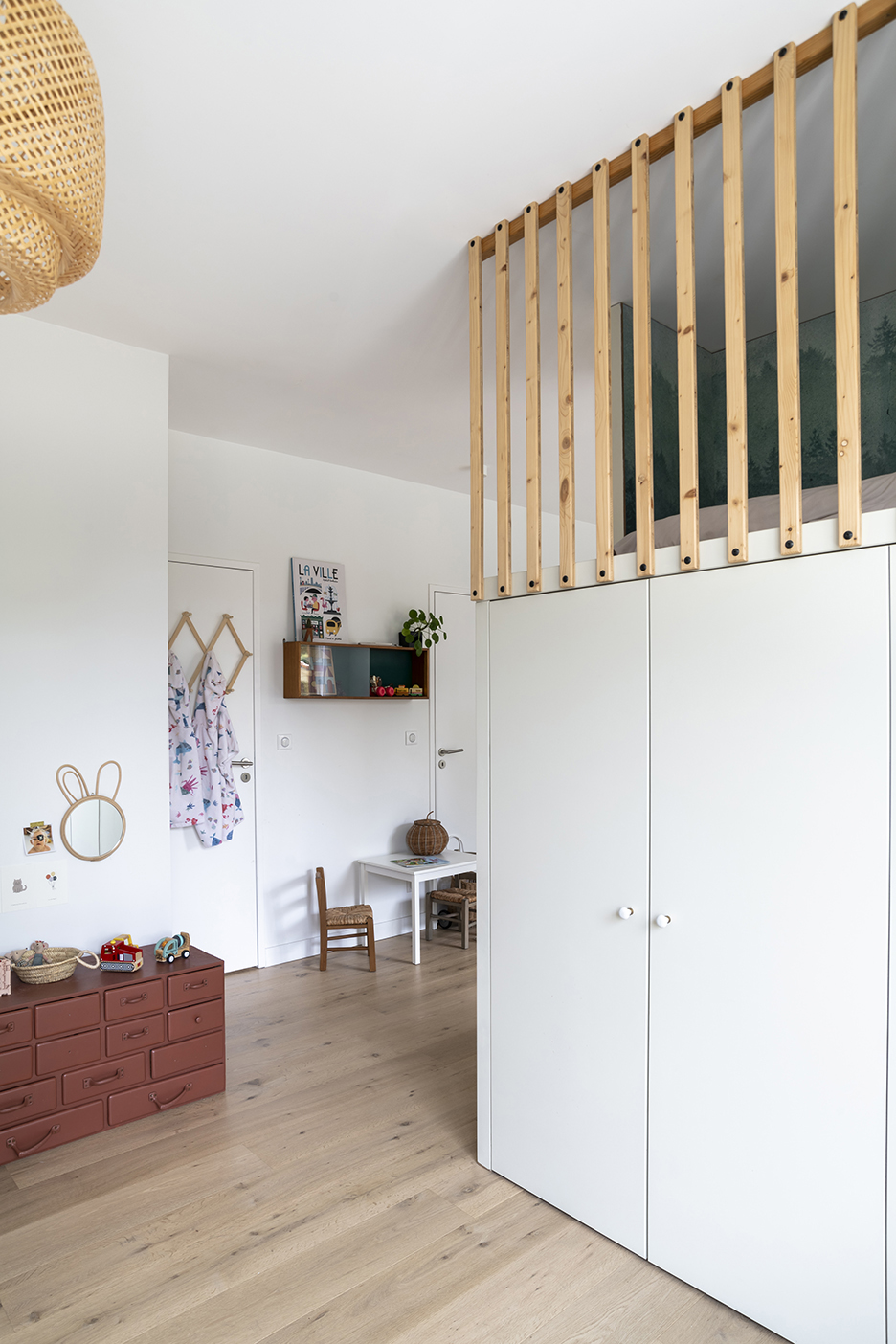 lofted bed in white room