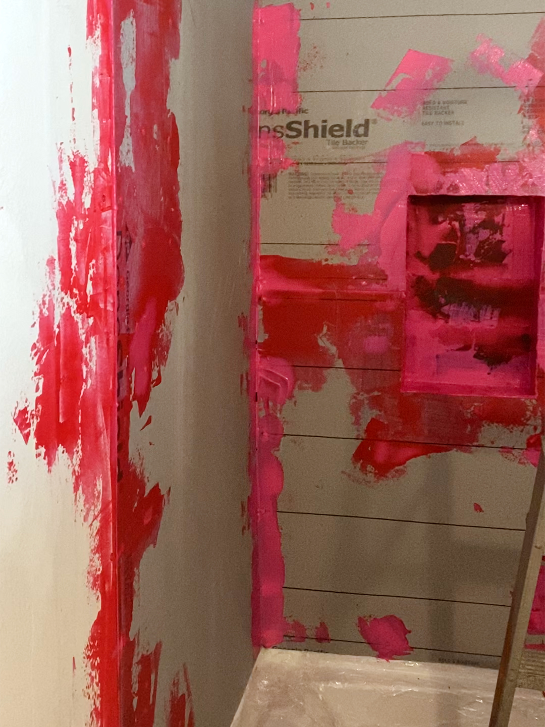 red waterproofing board