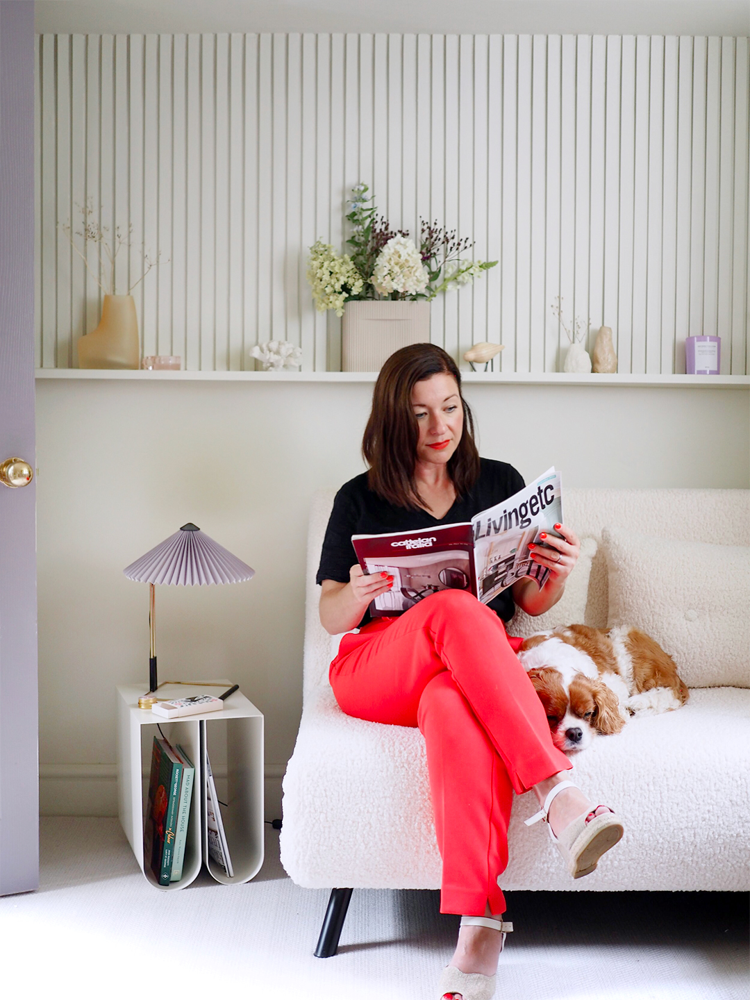 woman sitting on a white sofa