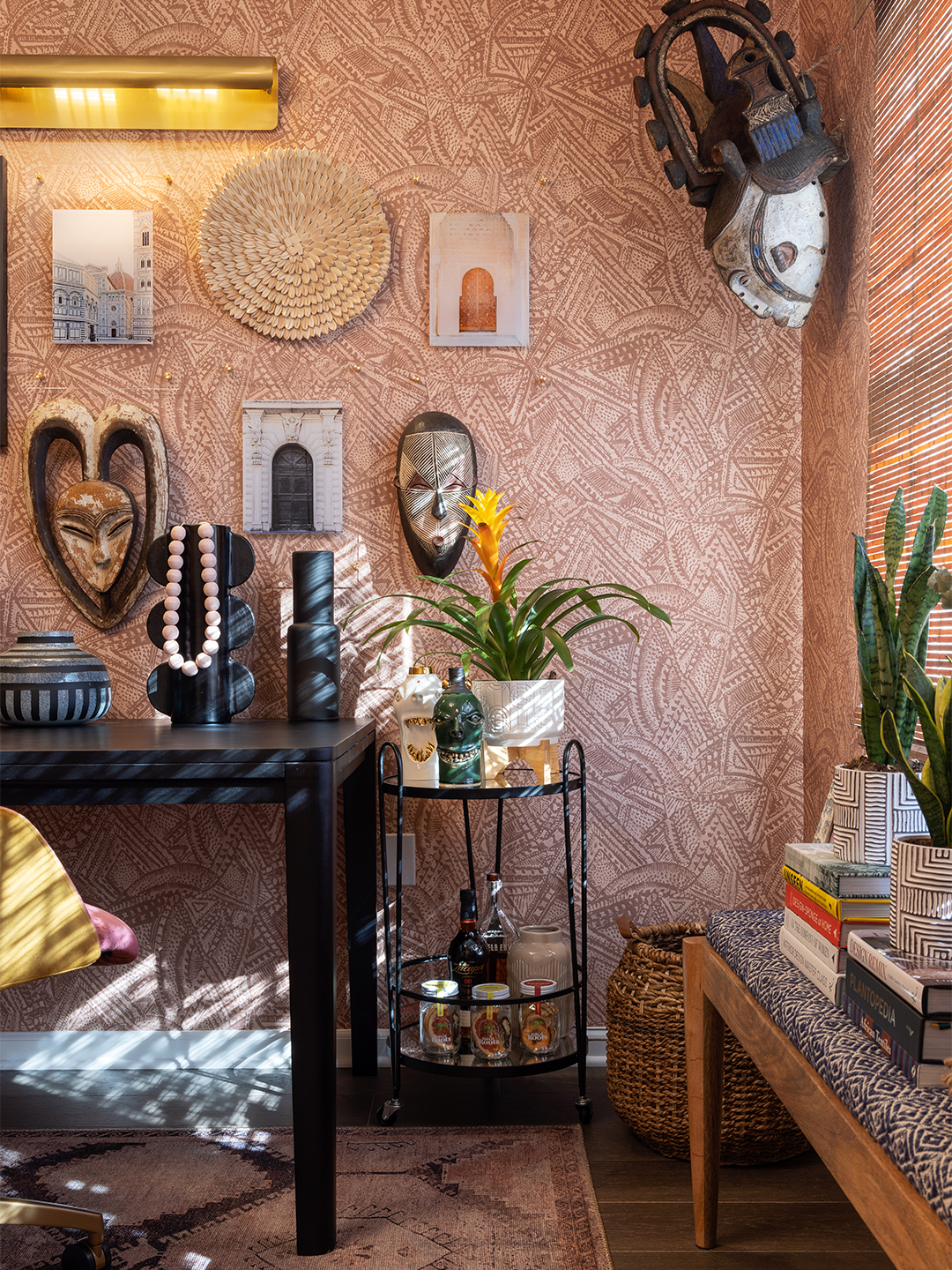 vintage masks and art on galler ywall