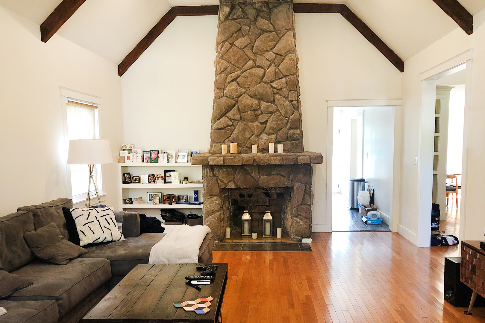 before image of living room with stone fireplace