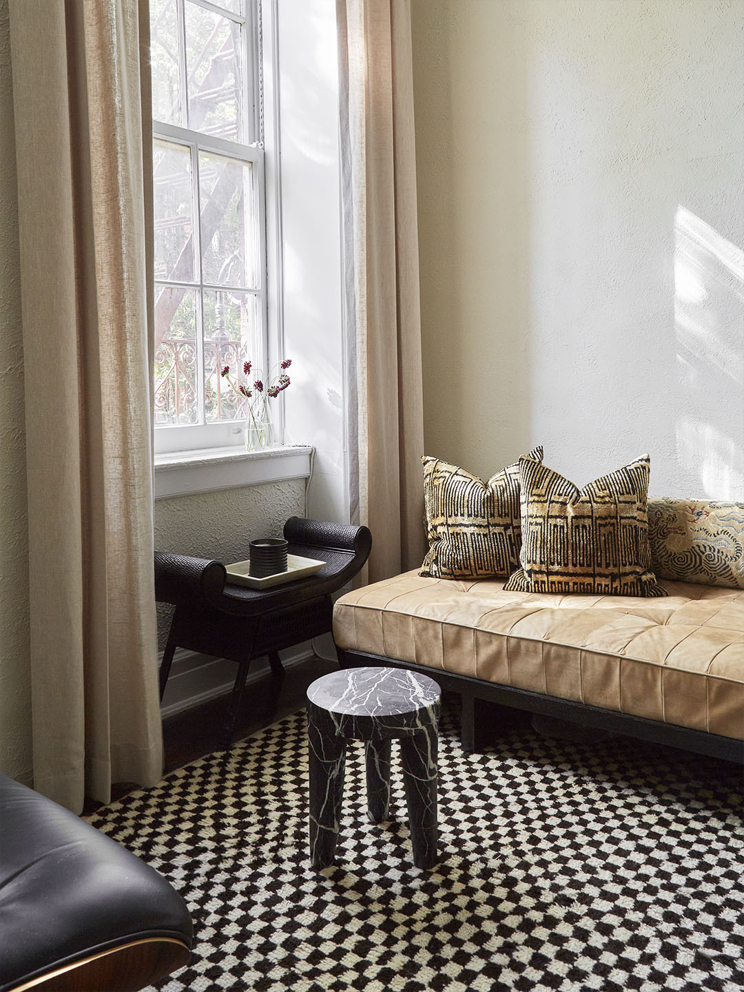 Living Room corner with open windows and curtains drawn back