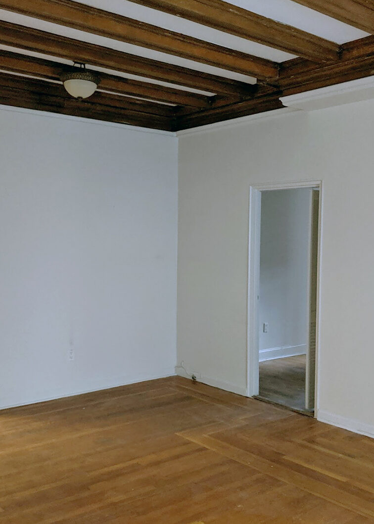 living room with beam ceiling