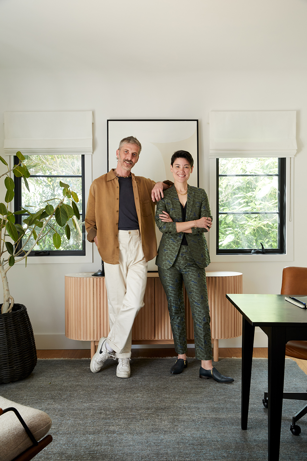 man and woman standing in office