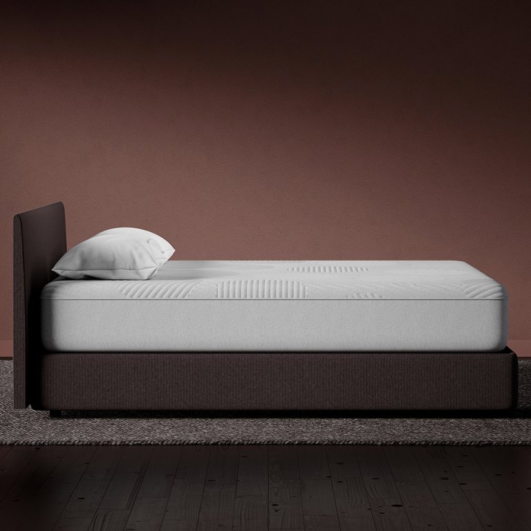  side view of casper nova hybrid mattress on wooden bed frame