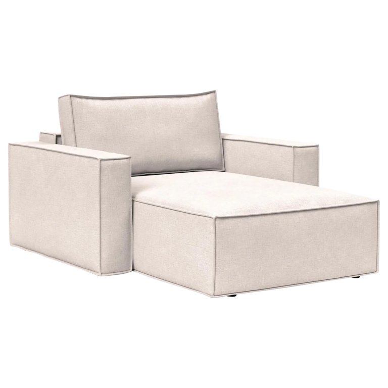 Cream boxy lounge chair on white background.