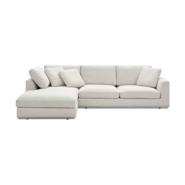 White sectional sofa on white background.