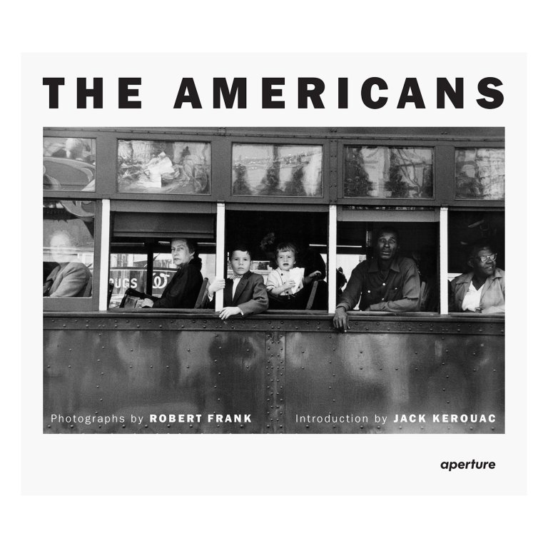  black and white photo of people on a bus