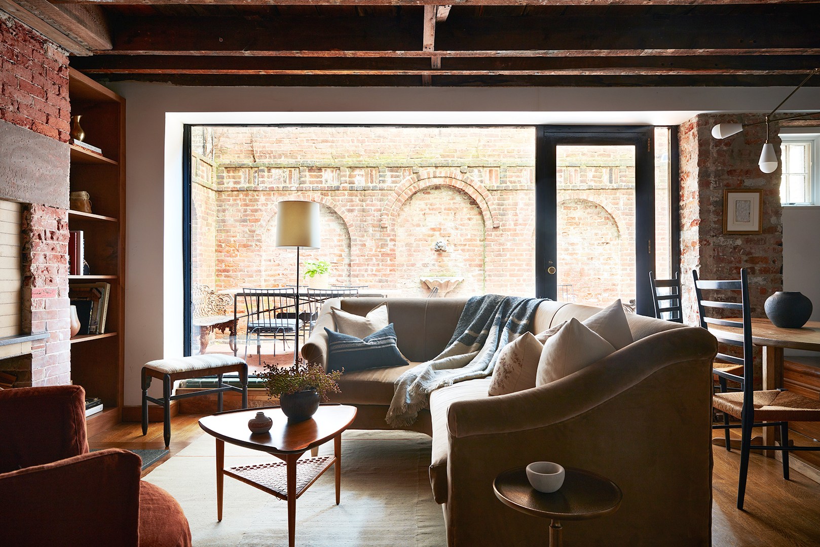 A Designer’s Tips for Decorating Around a Room with Exposed Brick - Cozy Exposed Brick Apartment Decor Ideas