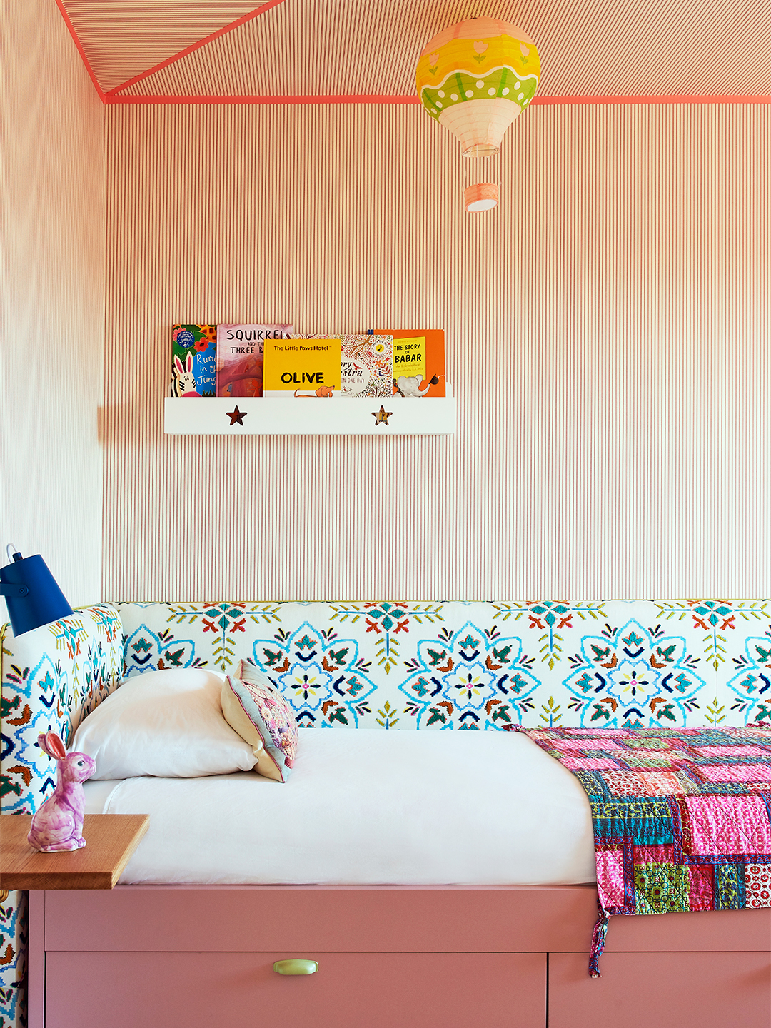 kids room with striped wallpaper