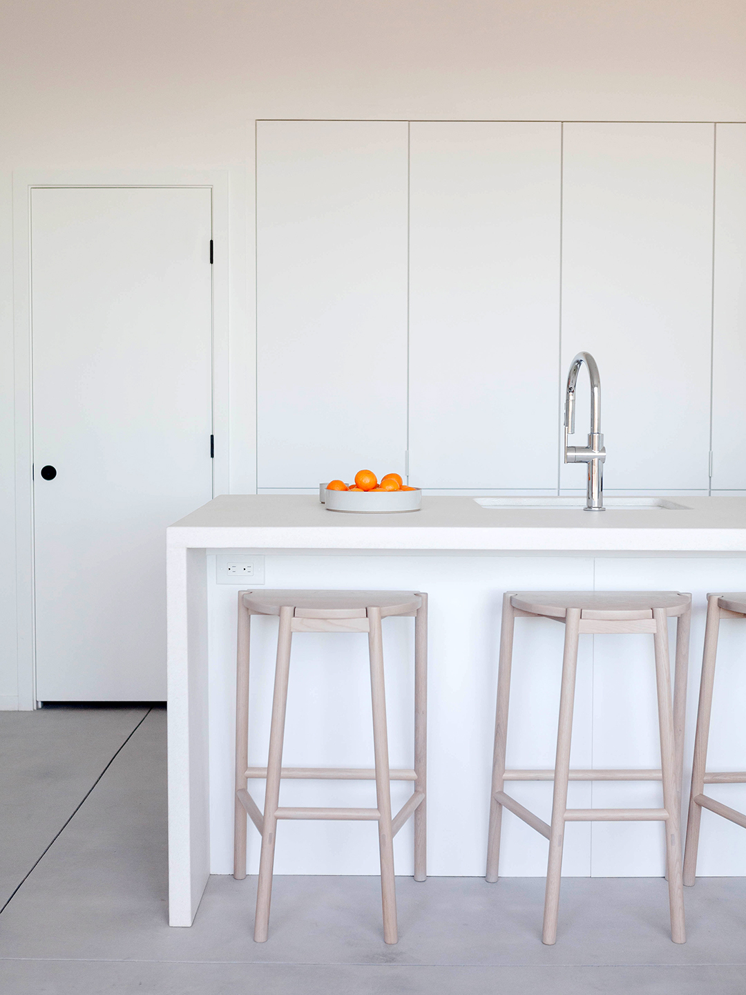 wooden stools at island