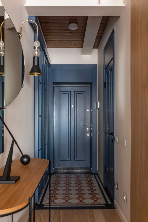 Tour a Kyiv, Ukraine, Apartment With Dreamy Wood Built-Ins and a Blue Entry