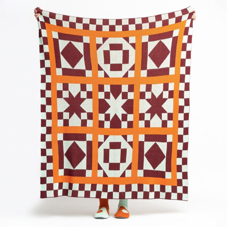  Verloop quilt block throw in orange and maroon
