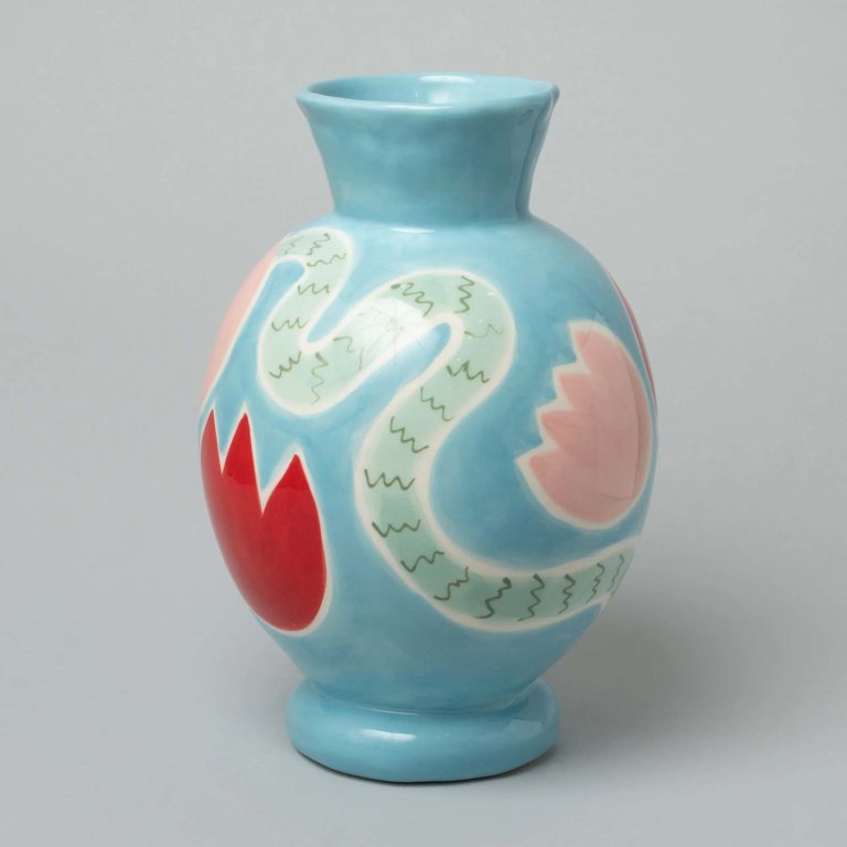 Blue vase painted with red and pink tulip