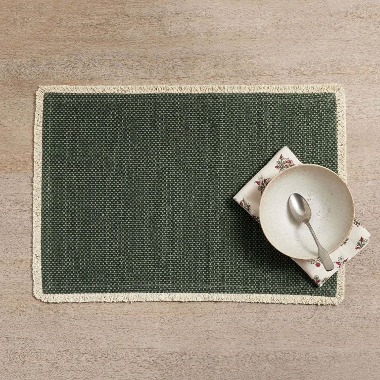  Green woven placemat with fringe trim